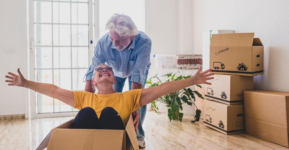 elderly couple with boxes